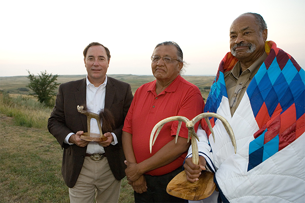 Standing Rock Sioux Tribe Council Representative honors FEMA Region VIII Regional Administrator and FEMA Tribal Region VIII Tribal Liaison Officer during the ten-year commemoration of the FEMA Tribal Relations policy.