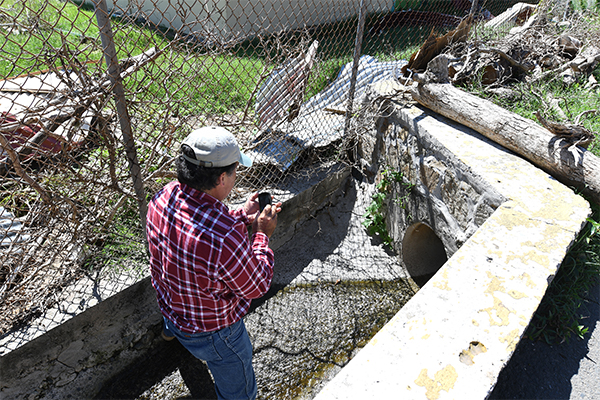 A USDA Natural Resource Conservation Service team member assessing areas impacted by the recent hurricanes.