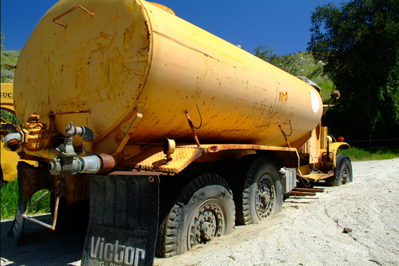 A water tanker is stuck in a mudslide.