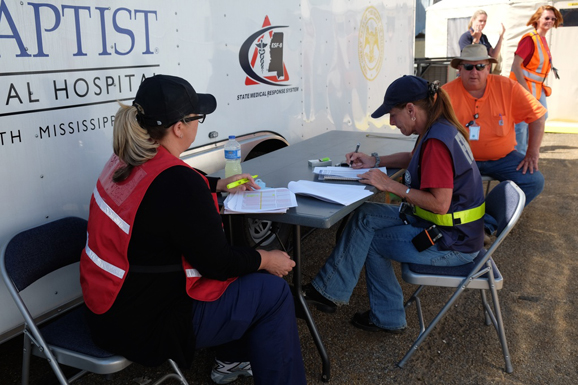 FEMA and Mississippi Emergency Management Agency are comparing inventory lists at the mobile hospital site.