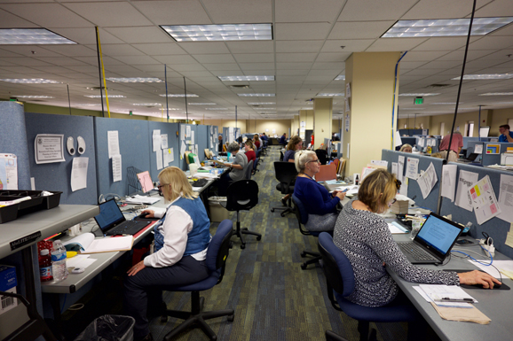 A view down two rows of people working on computers.