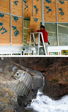 Numbered plywood panels are secured in place to protect the store front windows as merchants make preparations for Hurricane Rita's arrival. A construction crew with heavy equipment working on gabion walls to stabilize a road bank.