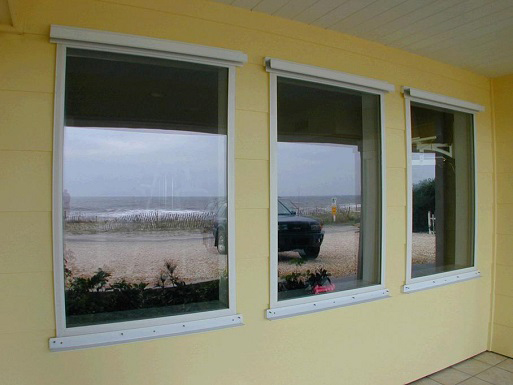 A row of new windows in a beach-front building.