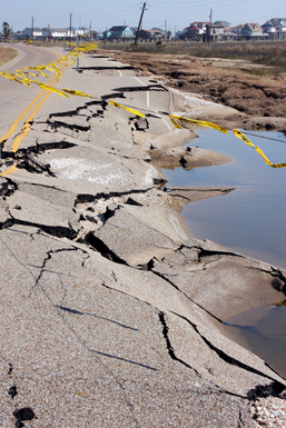 The ground below this street paving was washed away by Hurricane Ike's storm surge, causing the road to collapse. Miles of this Galveston Island highway are destroyed and completely washed away.