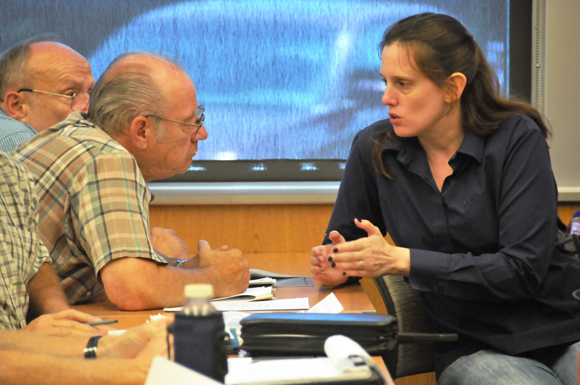 A FEMA Public Assistance Branch Chief answers a question from a local government official during an applicant briefing.