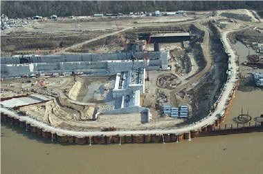 Aerial view of a dam being built, changing the water flow and possible flood plan.