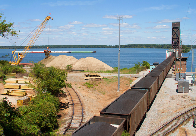 A crane next to a river.