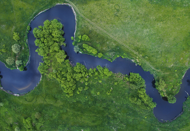 An aerial view of a river winding through the countryside.