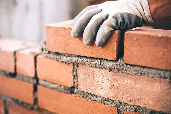 Worker laying brick