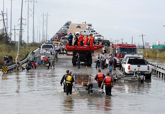 Many vehicles on a bridge as well as the FEMA Urban Search and Rescue Operations.