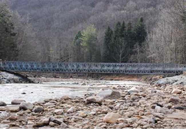 A temporary bridge over a river.