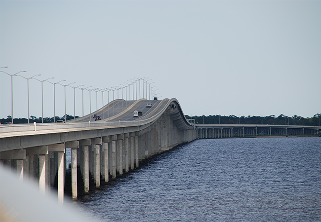 The new Bay St. Louis Bridge with cars driving over it.