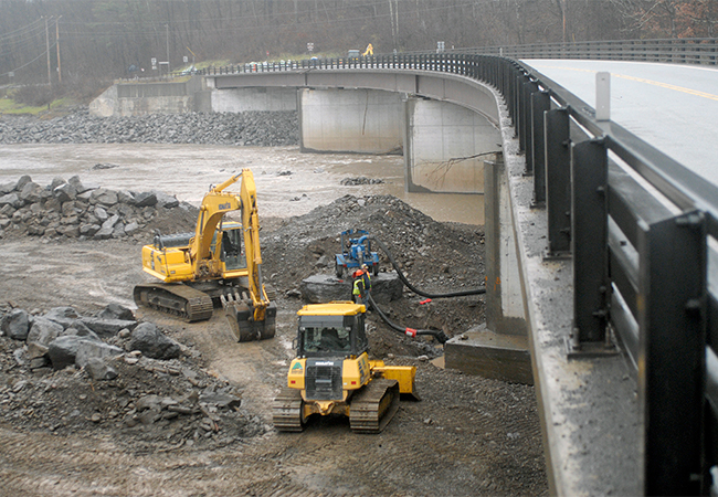 Contractors work on rebuilding the bridge piers damaged by flooding of the Schoharie Creek during Hurricane Irene.