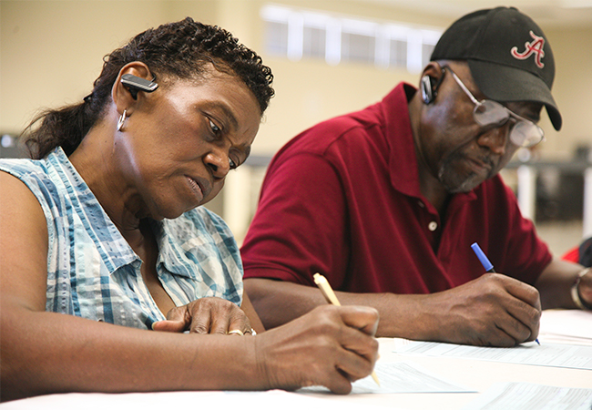 Two disaster survivors applying for financial assistance.