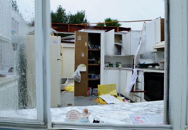 Inside of a damaged building with the roof blown off