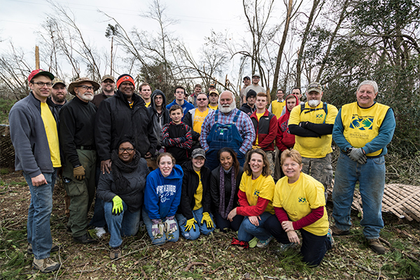 Team members from Mormon Helping Hands volunteer to assist disaster survivors on Holly Drive recover from the destructive effects of severe storms, tornadoes and straight-line winds that occurred on January 2 and January 21-22, 2017