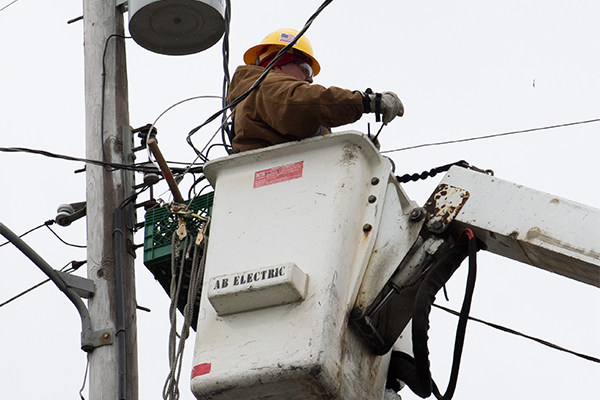 Mantoloking, N.J., March 8, 2013 -- Utility company employee restores power while working on power lines.