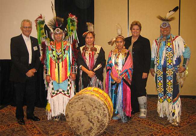 Tribal leaders and State officials posing together.