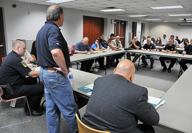 DHS and FEMA officials meeting with local government officials to discuss Federal assistance.