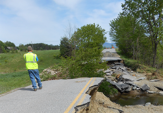 FEMA Preliminary Damage Assessment team member evaluates flood damage in Essex, Vermont.