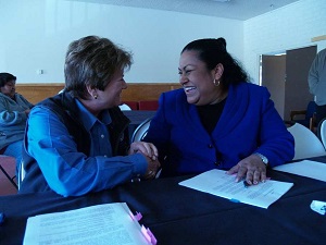 Photo of Federal Coordinating Officer Sandy Coachmen shaking hands with Campo Band of Mission Indians Tribal Chairwoman Monique LaChappa after signing FEMA-Tribal Agreement.