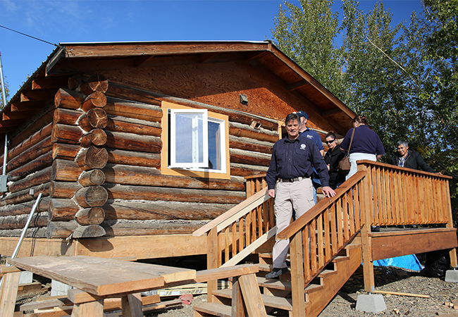 Federal Coordinating Officer and Athabaskan Tribal Chief tour a Home