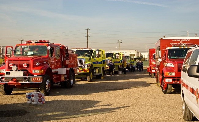 Wild land firefighting apparatus and vehicles staged at the Prado Staging Area in Chino, California.