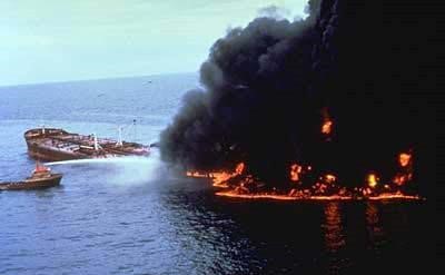 Ariel view of the SS Atlantic Empres ship sinking after a crash. The oil spilled in the water is on fire.