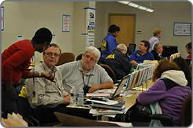 Image of representatives from different agencies working together
