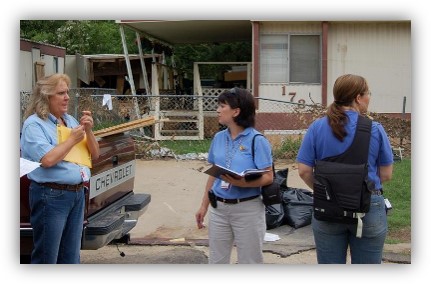 Three recovery staff at disaster site for assessment