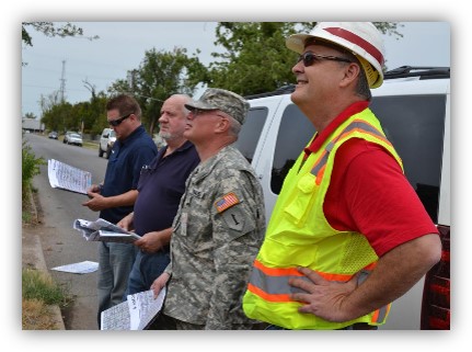 Personnel assessing damage