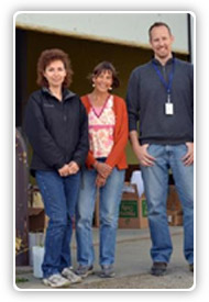 Disaster survivors and FEMA employees smiling