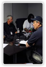 IMT Staff meeting at a conference table